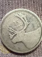 1937 Canada 25 cents coin reverse showing caribou
