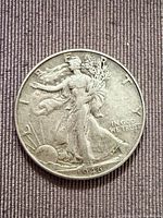 Obverse view of 1946 Walking Liberty half dollar showing date, design details, and wear