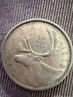 Obverse showing caribou design, year and denomination