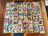 Grid layout showing entire lot of roughly 36 football trading cards
