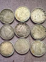 Nine Canadian 10-cent coins arranged in three rows