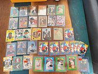 Wide view showing full assortment of baseball cards laid out in rows