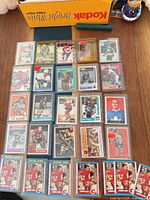 Overall view showing 25+ cards in sleeves