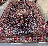 Full view of Hamadan rug displaying navy field, medallion, and borders