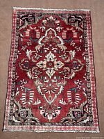 Full view of red geometric Hamedan rug
