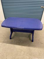 Overall view of blue plastic folding table