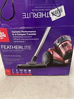 Purple Dirt Devil Featherlite box showing product image and specifications