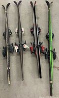 Four pairs of skis standing vertically