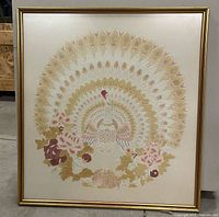 Front view of framed peacock artwork