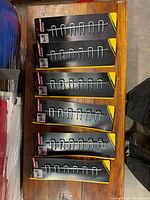 Six Fuller multi tool racks on cards