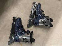 Pair of blue and grey inline skates, overall view