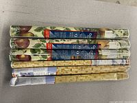 Six rolls of contact paper showing both patterns