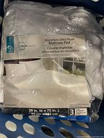 Front label of mattress pad showing brand, type, size