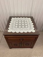 Overhead view showing glass top and wood finish