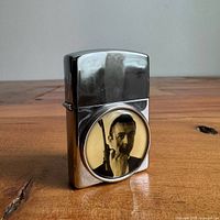 Lighter closed front view showing circular James Bond image