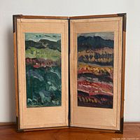 Diptych oil paintings open in hinged frame