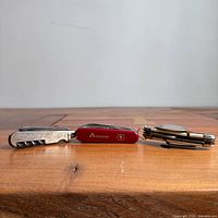 Side view of all three folded pocket knives