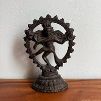 Front view of bronze Shiva Nataraja statue on pedestal