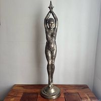 Full view of 4 ft tall metal starfish dancer sculpture on pedestal base
