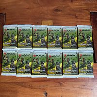 Front view of the 12 sealed Jumpstart booster packs laid out