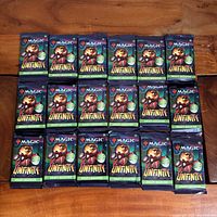 All 18 sealed Unfinity draft booster packs arranged face up