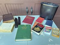Lot overview with shredder, dictionaries, atlas, medical and pocket books