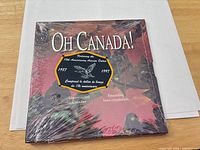 Front cover showing title, anniversary crest, shrink wrap