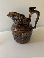 Left side view showing relief decoration and glaze colors