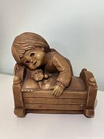 Front angled view showing child over baby in crib