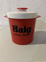 Front view of Haig Scotch Whisky plastic ice bucket with lid on