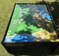 Top view of play table showing printed landscape panels