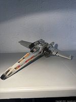 Starboard view of Kenner X-Wing toy showing overall form and decals