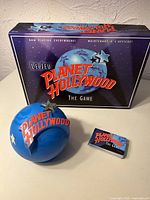Game box front, globe dispenser, card deck