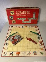 Box, board, bag of tiles, chips, pencils