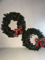 Both wreaths hung on wall showing overall appearance