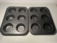 Top view of both pans showing six wells each