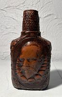 Front view showing raised Don Quixote portrait and bottle shape