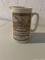 Front view showing transfer print text and brewery scene