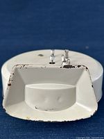 Underside and base illustrating paint wear, rust spots