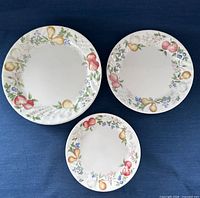 Three Corelle Chutney plates of different sizes displayed flat