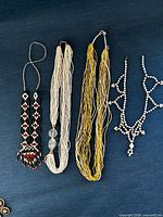 All four necklaces displayed