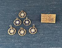 Group view showing six pendants and pin