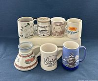 Group shot of all seven mugs front and top view