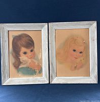 Front view of both framed prints side by side