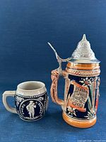 Beer stein and stoneware mug front view