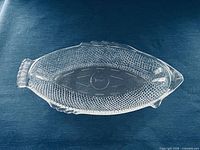 Top view of entire fish-shaped platter showing form and scale texture