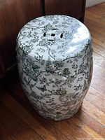 Full view of porcelain garden stool standing upright