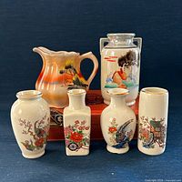 Group shot of lusterware vase, four miniature vases and creamer