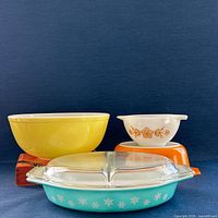 Group of four Pyrex pieces showing colors, patterns, and relative sizes
