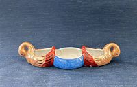 front view showing bird handles and three wells